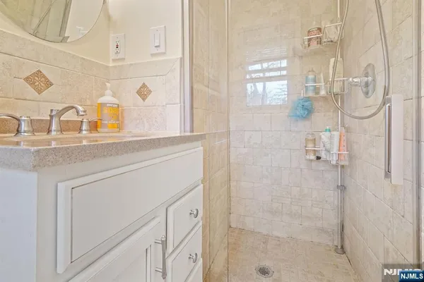 a bedroom with a bed and a wooden floor