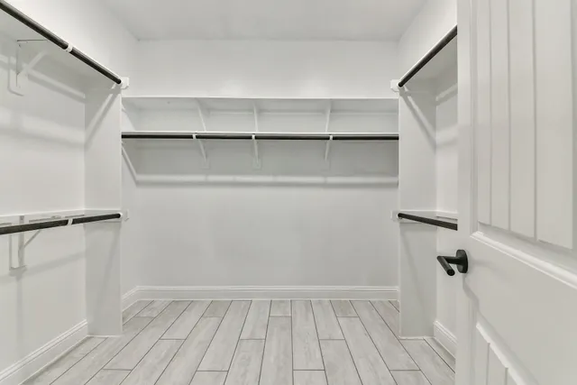 a view of an empty walk in closet