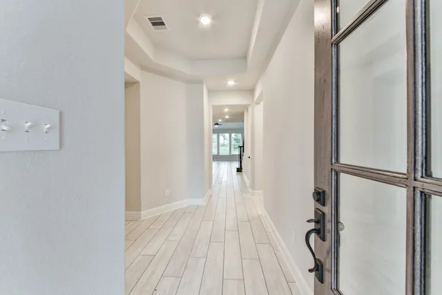 a view of a room with wooden floor and staircase