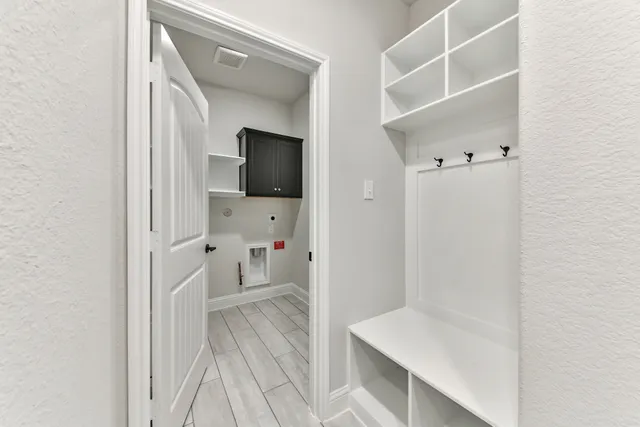 a view of hallway with wooden floor