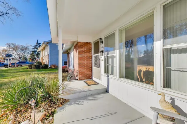 a view of a house with a yard patio and swimming pool