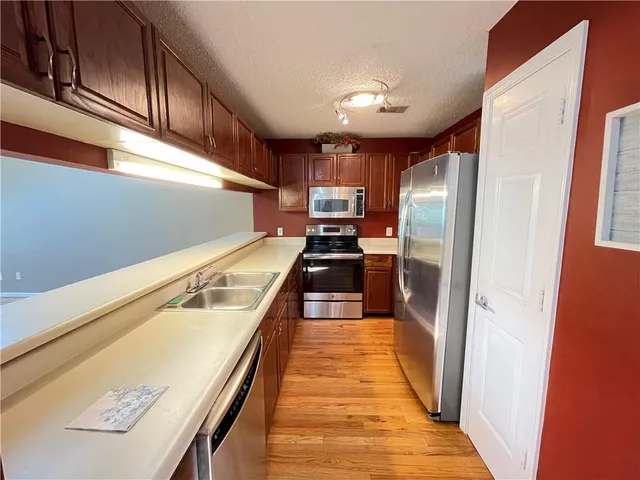 a view of a kitchen with a sink