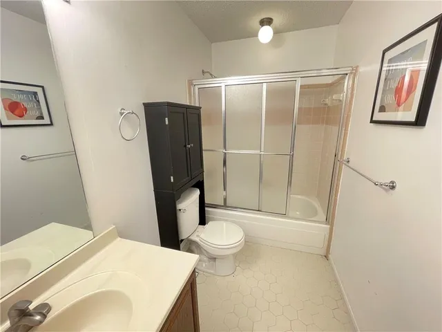 a bathroom with a sink and toilet