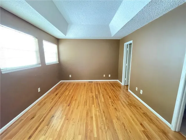 a bathroom with a sink and a wooden floor