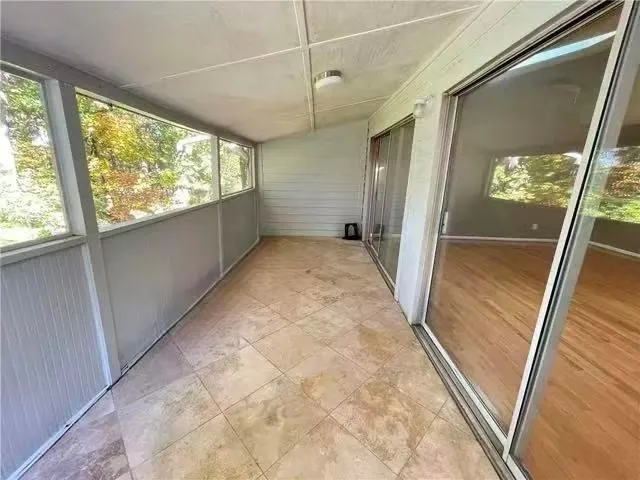 a view of a room with a large window