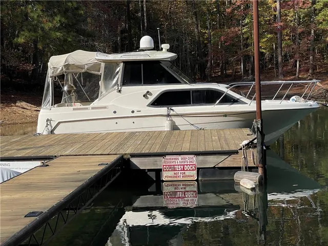 a view of swimming pool with outdoor seating yard and lake view