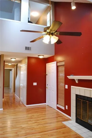 a view of an empty room with a fireplace