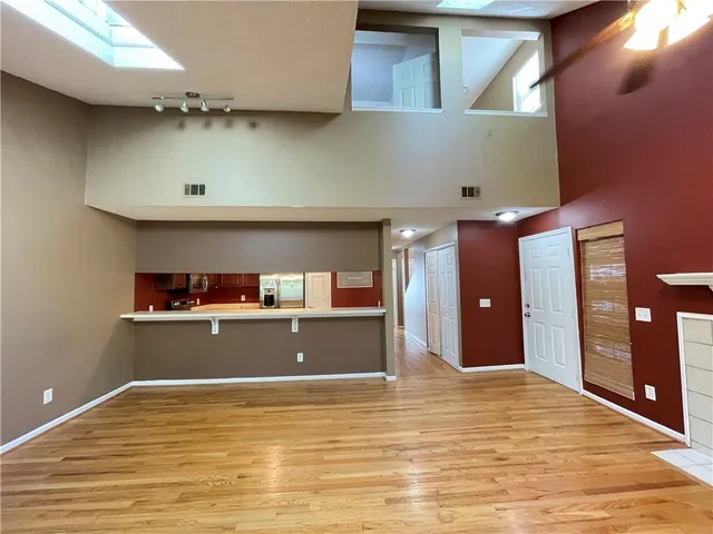a view of a room with wooden floor