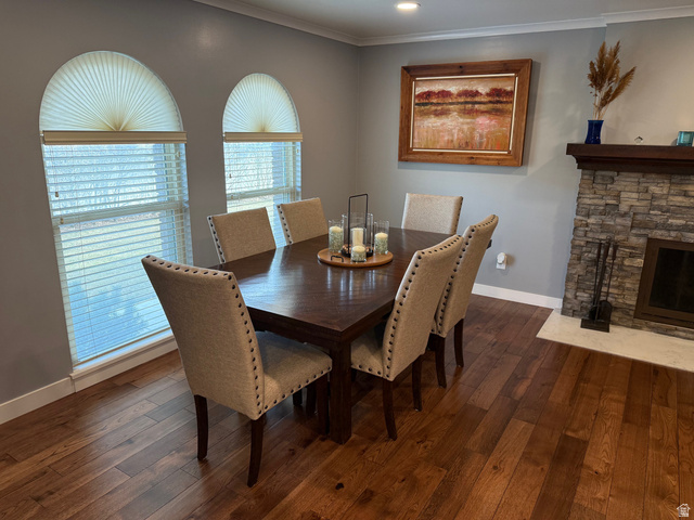 362 East 9150th Street South Sandy, UT 84070 - Photo 7 of 41 Dining space featuring solid hickory flooring , ornamental molding, and a fireplace