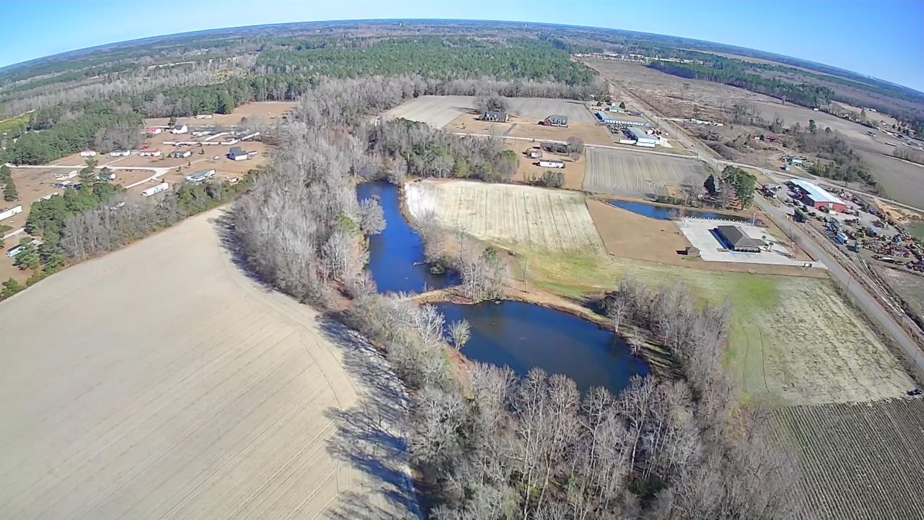 Tbd Senator Gasque Road Mullins, SC 29574 - Photo 1 of 15 Aerial view of property's location featuring a large body of water and a heavily wooded area