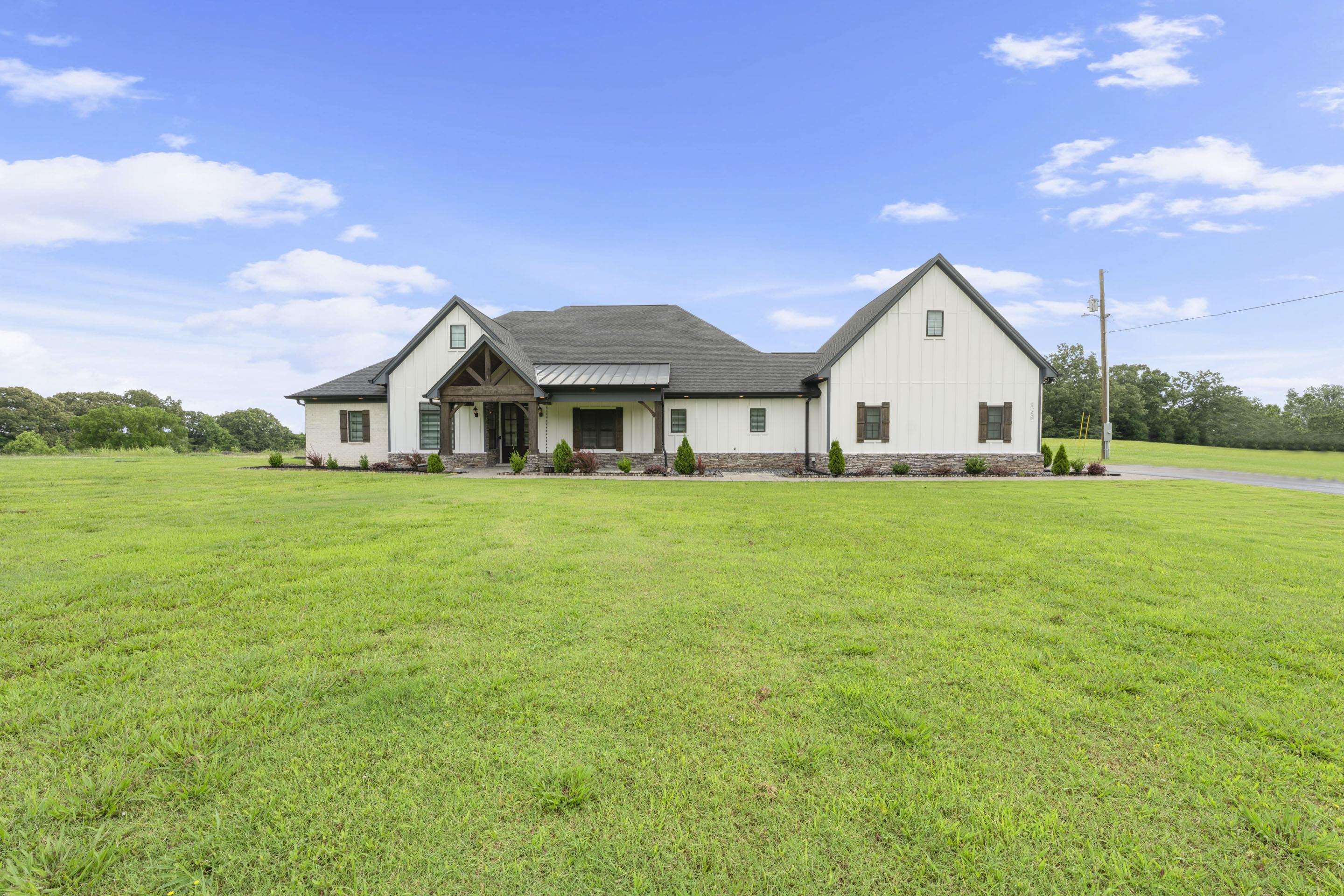 2295 Tomlin Road Somerville, TN 38068 - Photo 1 of 38 Modern inspired farmhouse featuring board and batten siding and a front lawn