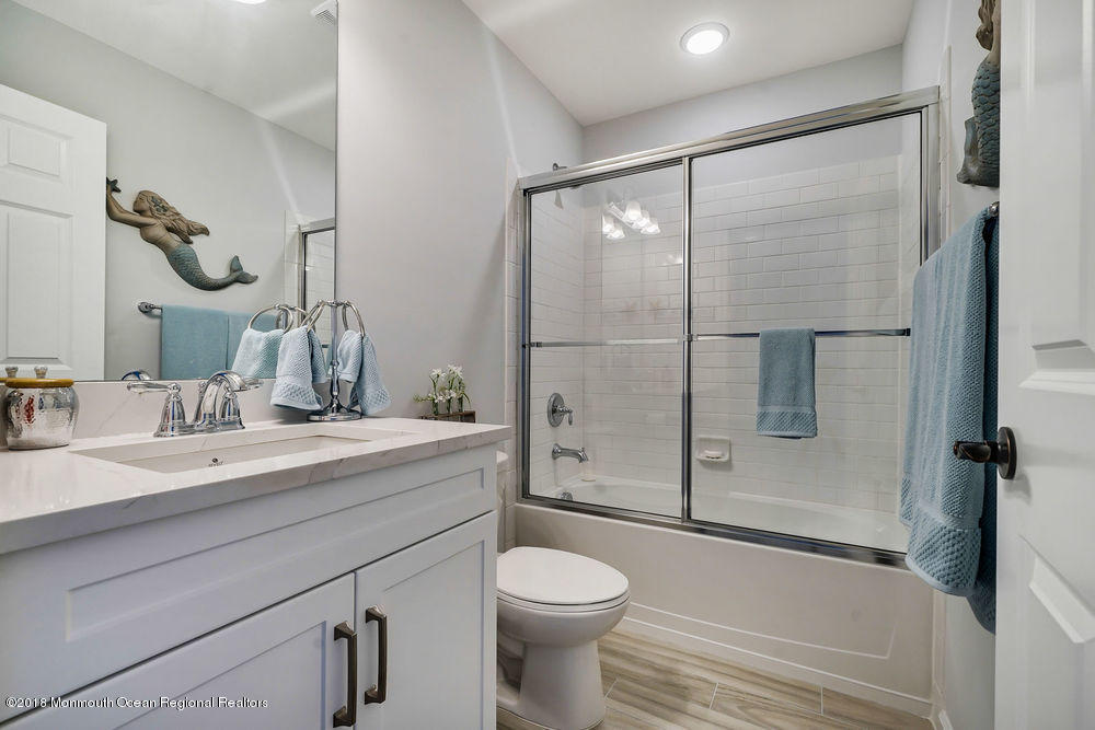 11 Lighthouse Point Road, Unit 601 Highlands, NJ 07732 - Photo 34 of 79 a bathroom with a sink toilet and shower
