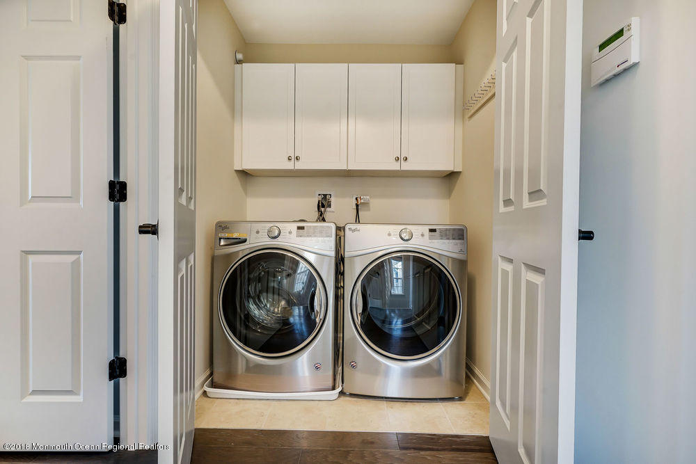 11 Lighthouse Point Road, Unit 601 Highlands, NJ 07732 - Photo 36 of 79 a utility room with dryer and washer
