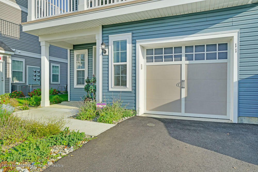 11 Lighthouse Point Road, Unit 601 Highlands, NJ 07732 - Photo 5 of 79 front view of a house with a yard