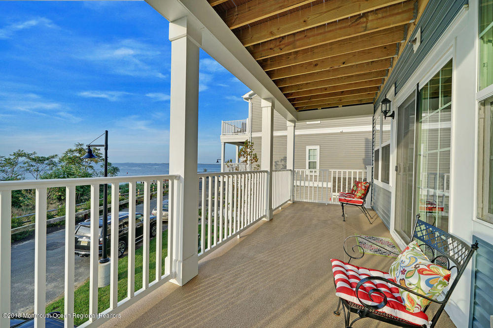 11 Lighthouse Point Road, Unit 601 Highlands, NJ 07732 - Photo 45 of 79 a view of a porch with furniture