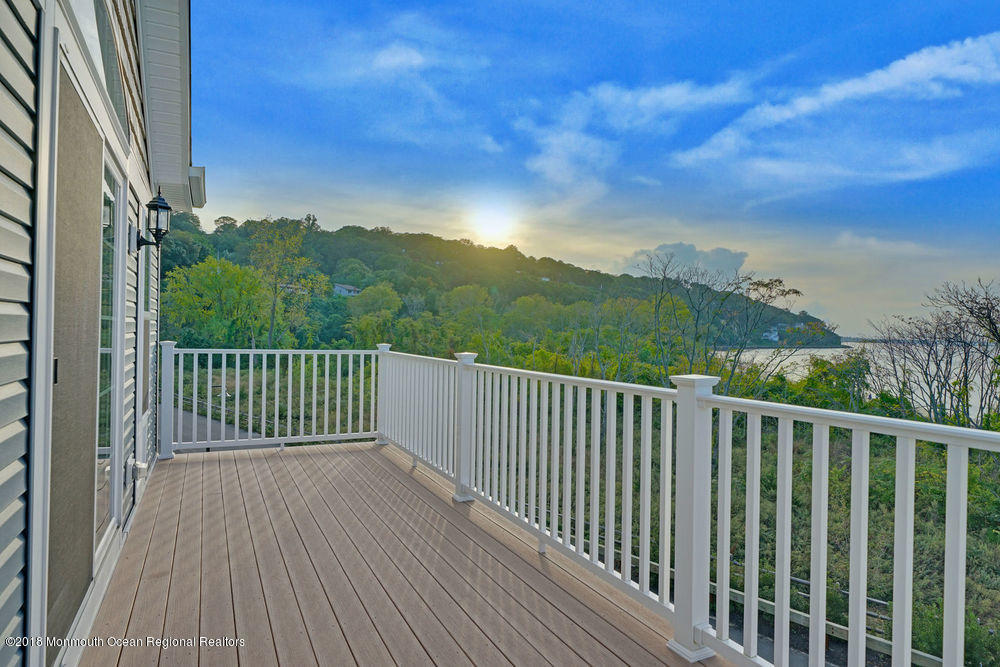 11 Lighthouse Point Road, Unit 601 Highlands, NJ 07732 - Photo 52 of 79 a view of a balcony with wooden fence and floor