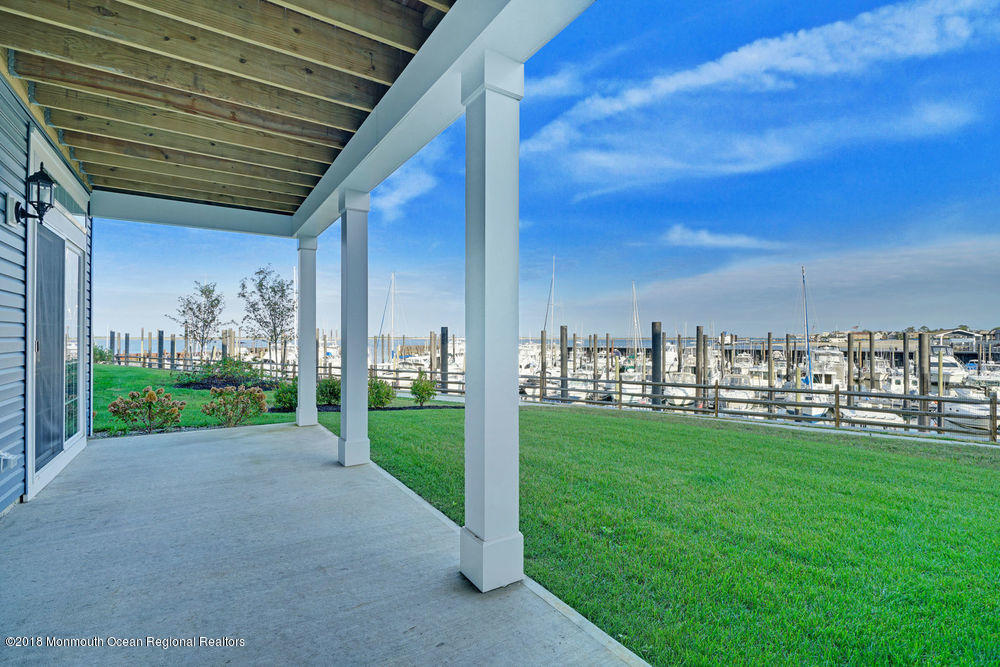 11 Lighthouse Point Road, Unit 601 Highlands, NJ 07732 - Photo 55 of 79 a view of a porch with a big yard