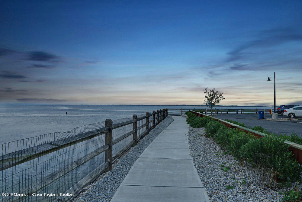 11 Lighthouse Point Road, Unit 601 Highlands, NJ 07732 - Photo 67 of 79 a view of a pathway with a wrought fence