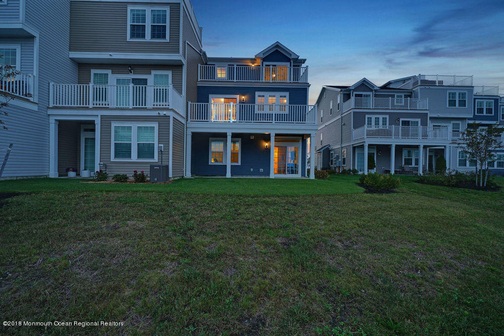 11 Lighthouse Point Road, Unit 601 Highlands, NJ 07732 - Photo 71 of 79 a front view of a building with a garden