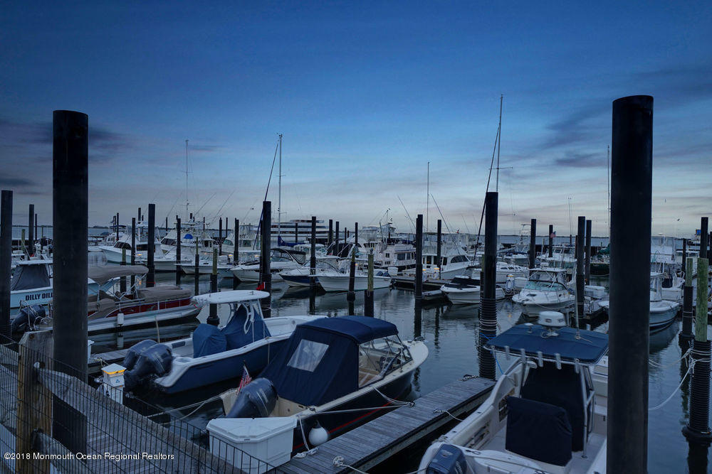 11 Lighthouse Point Road, Unit 601 Highlands, NJ 07732 - Photo 73 of 79 a terrace with outdoor seating and city view