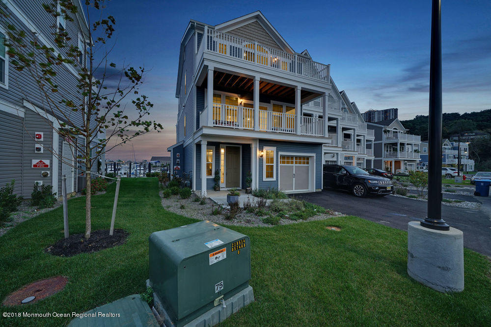 11 Lighthouse Point Road, Unit 601 Highlands, NJ 07732 - Photo 75 of 79 a front view of a house with a yard