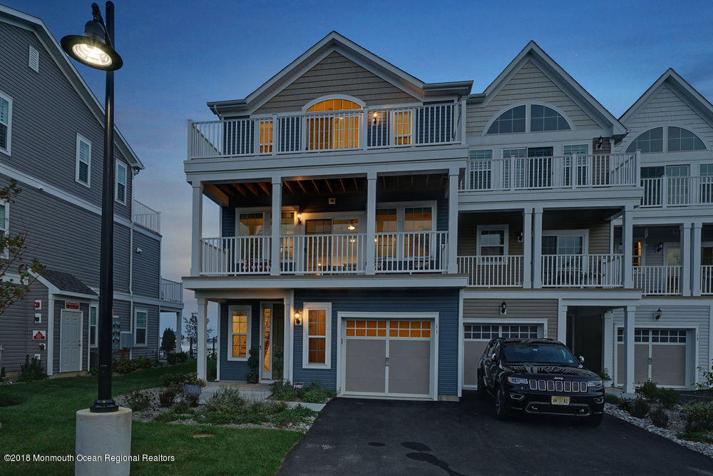 11 Lighthouse Point Road, Unit 601 Highlands, NJ 07732 - Photo 76 of 79 a front view of a house with cars parked