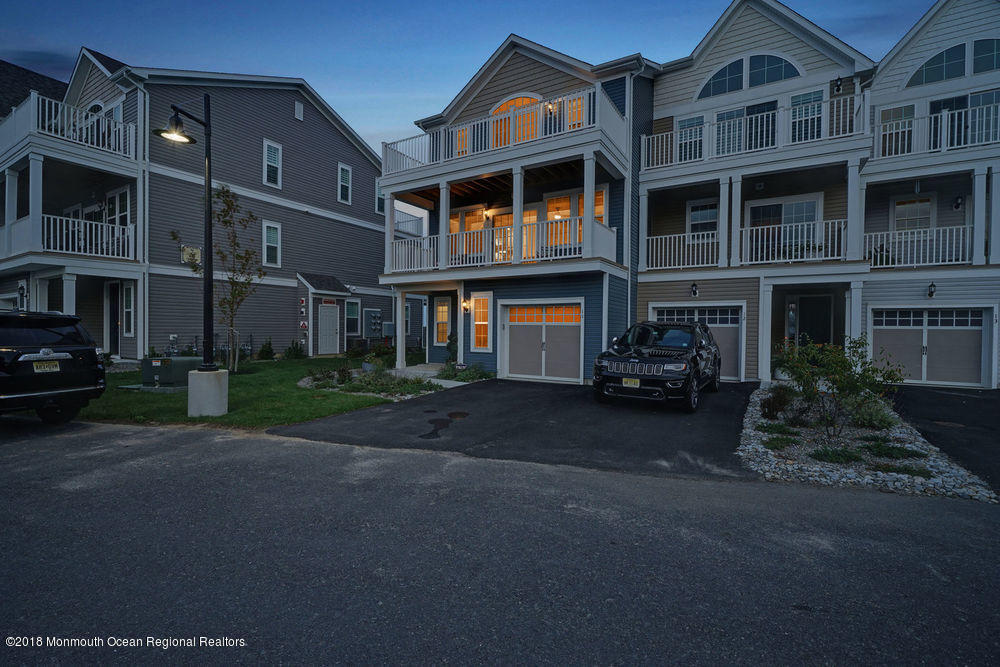 11 Lighthouse Point Road, Unit 601 Highlands, NJ 07732 - Photo 77 of 79 a front view of a building with a street