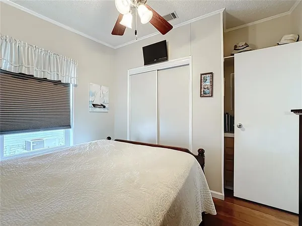 a bed room with a bed and a window