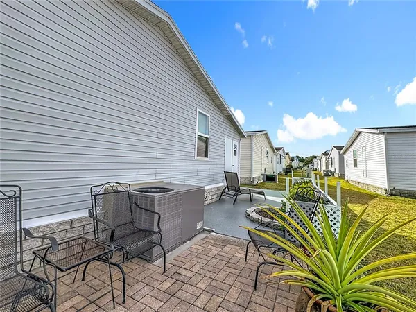 a dinning table and chairs in a patio