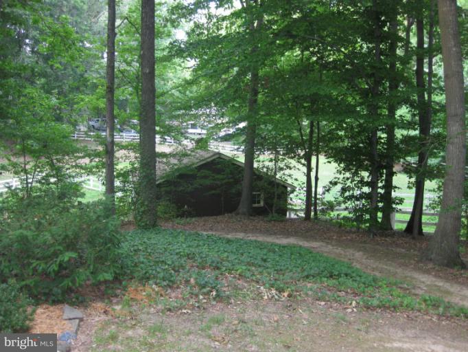 1980 Plum Point Road Huntingtown, MD 20639 - Photo 23 of 27 a big yard with lots of green space and fountain