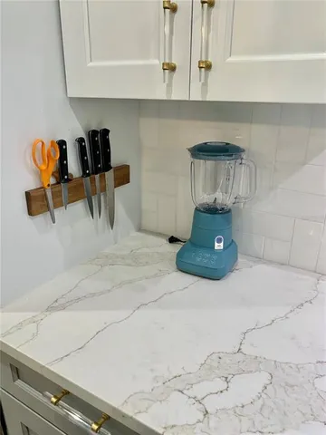 a kitchen with a stove and cabinets