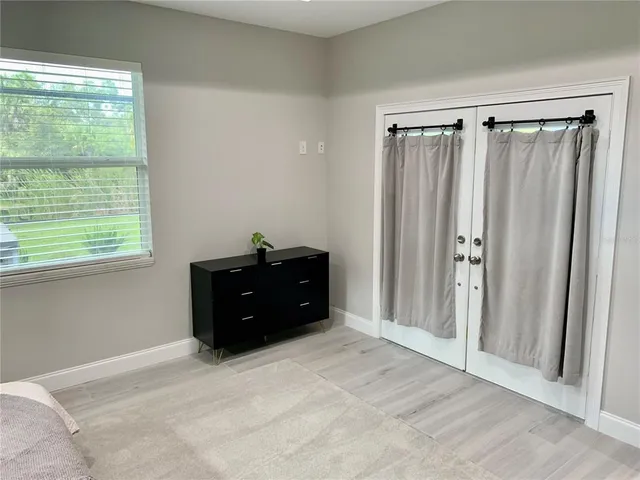 a room with a bed and a window