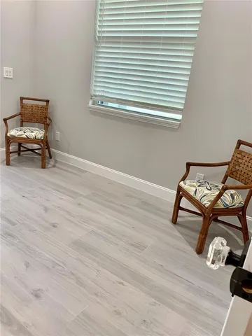 a room with a table and wooden floor