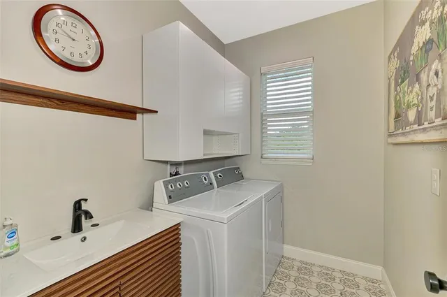 a view of a lake with a house in the background