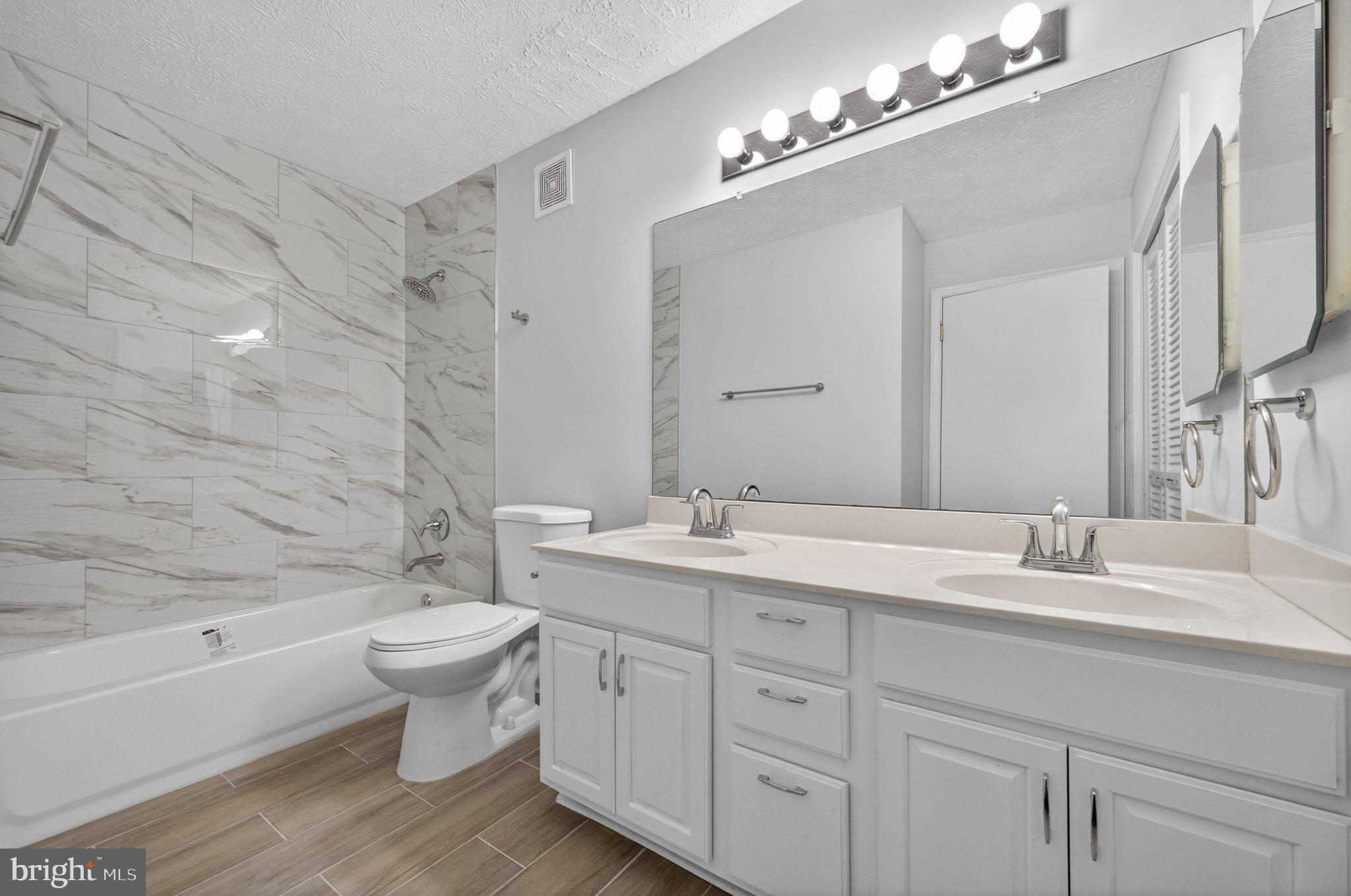 2281 Hunter's Run Drive, Unit 2281 Reston, VA 20191 - Photo 22 of 25 Modern elegance in a serene bathroom.
