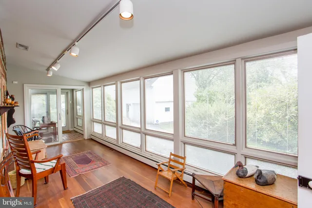 a view of a room with furniture and a window