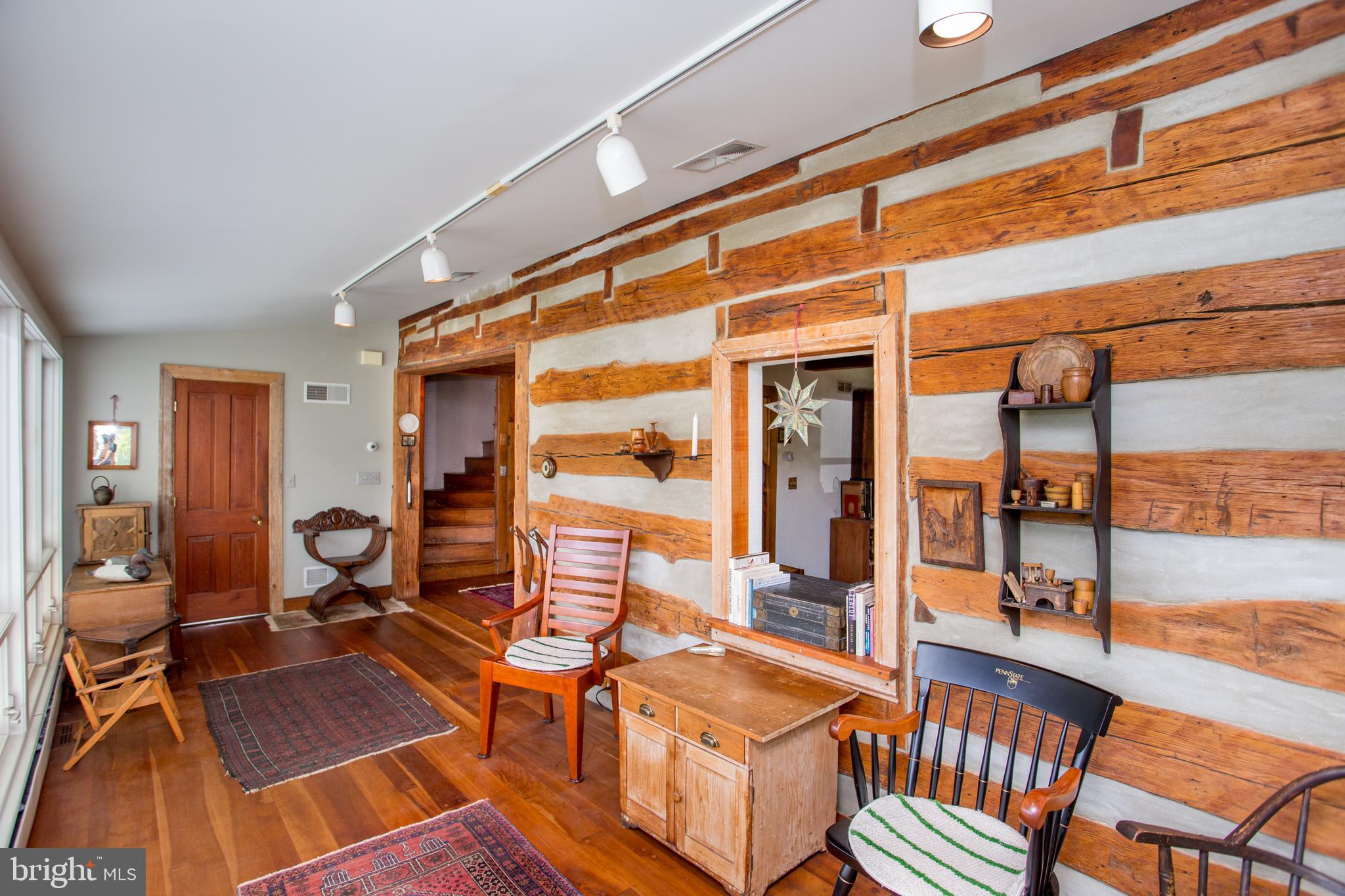 3416 Bursonville Road Riegelsville, PA 18077 - Photo 14 of 69 a living room with furniture a wooden floor and next to a window