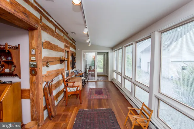 a living room with furniture and a rug