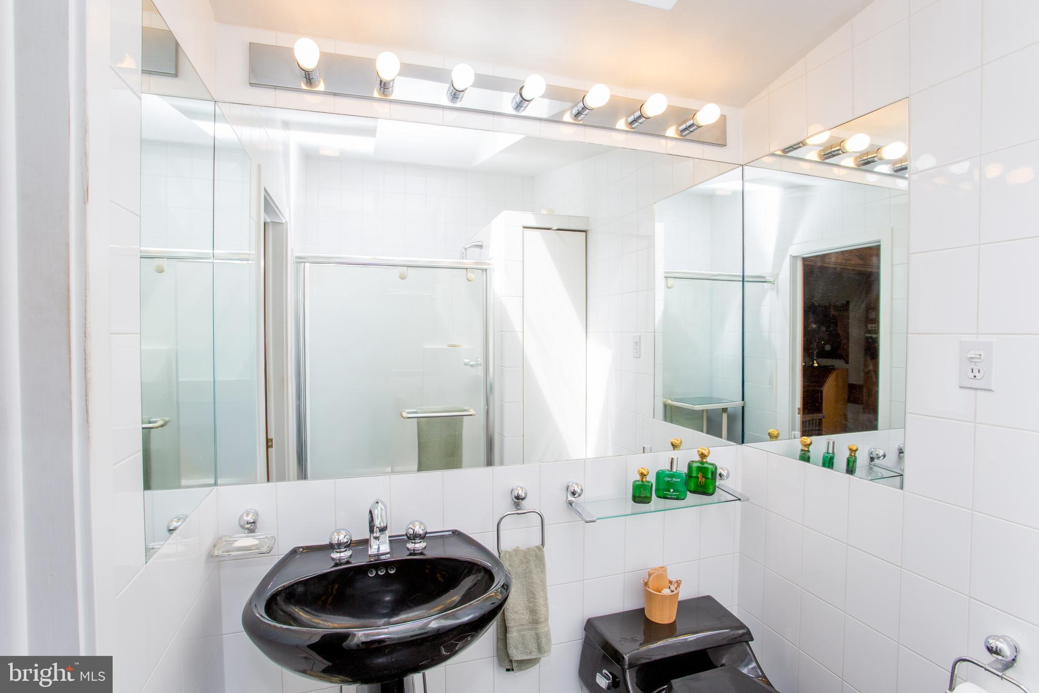 3416 Bursonville Road Riegelsville, PA 18077 - Photo 19 of 69 a bathroom with a sink and a mirror