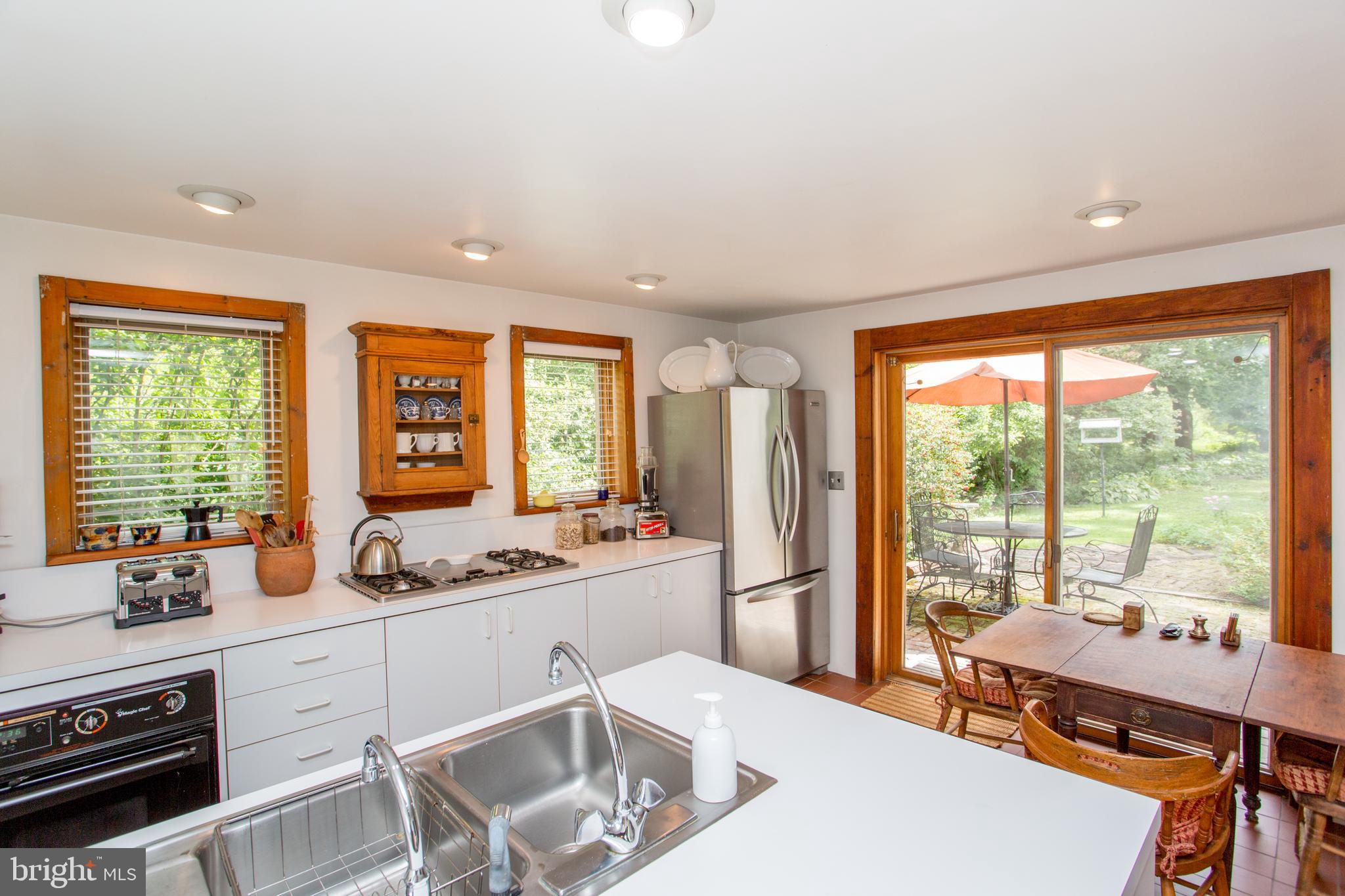 3416 Bursonville Road Riegelsville, PA 18077 - Photo 27 of 69 a room with a table chairs and a large window