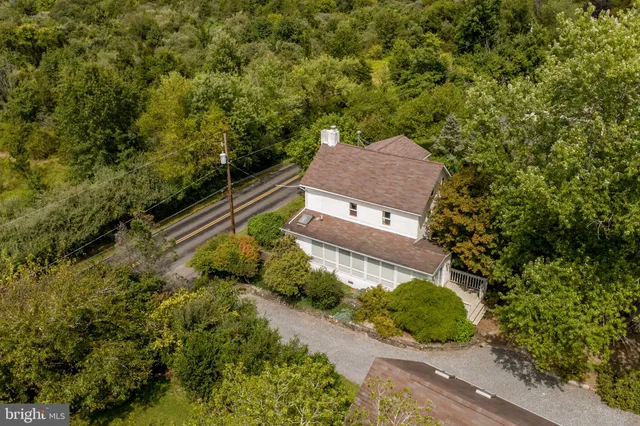 an aerial view of a house with a garden