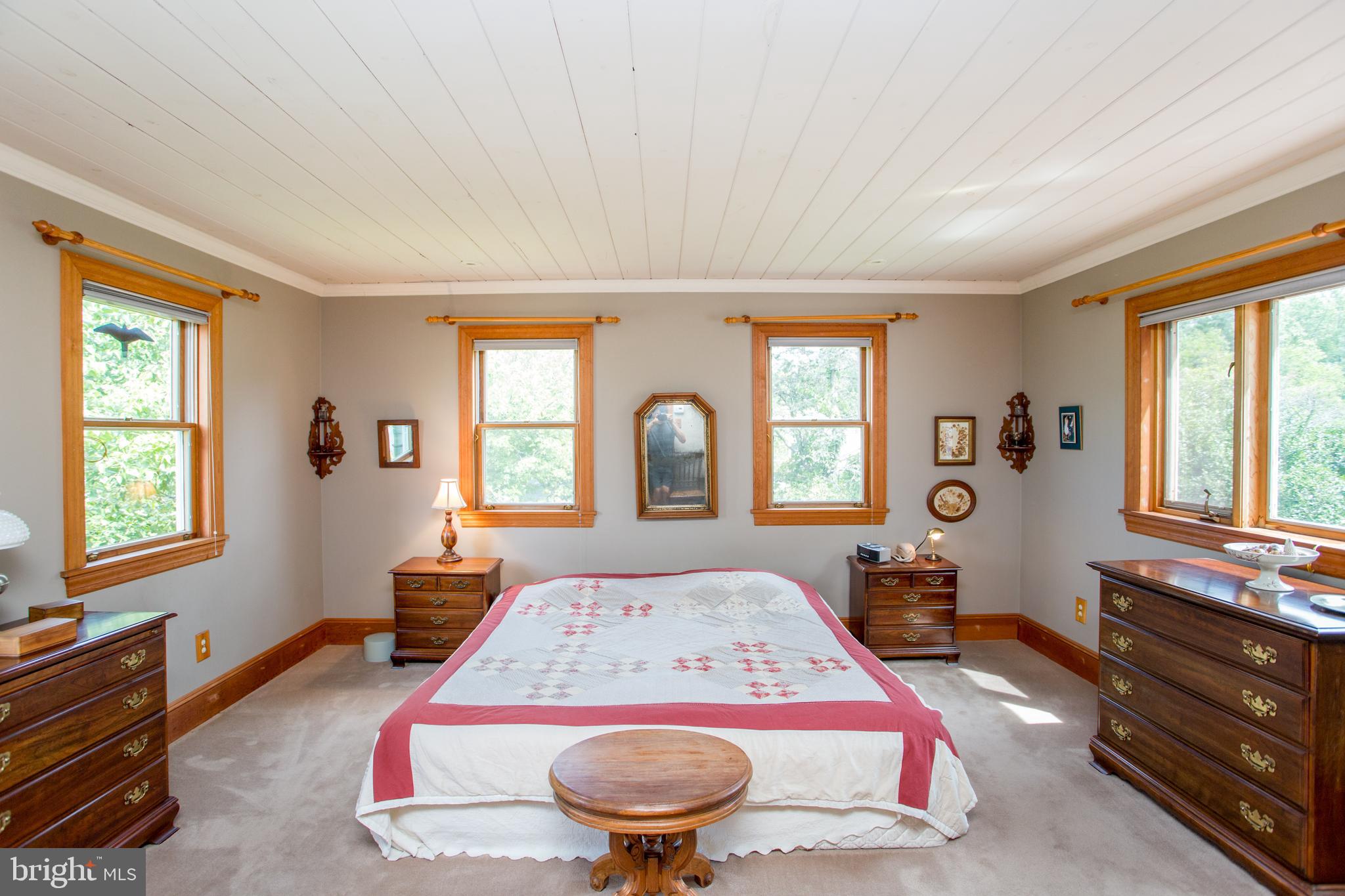 3416 Bursonville Road Riegelsville, PA 18077 - Photo 31 of 69 a bed sitting in a bedroom next to a window