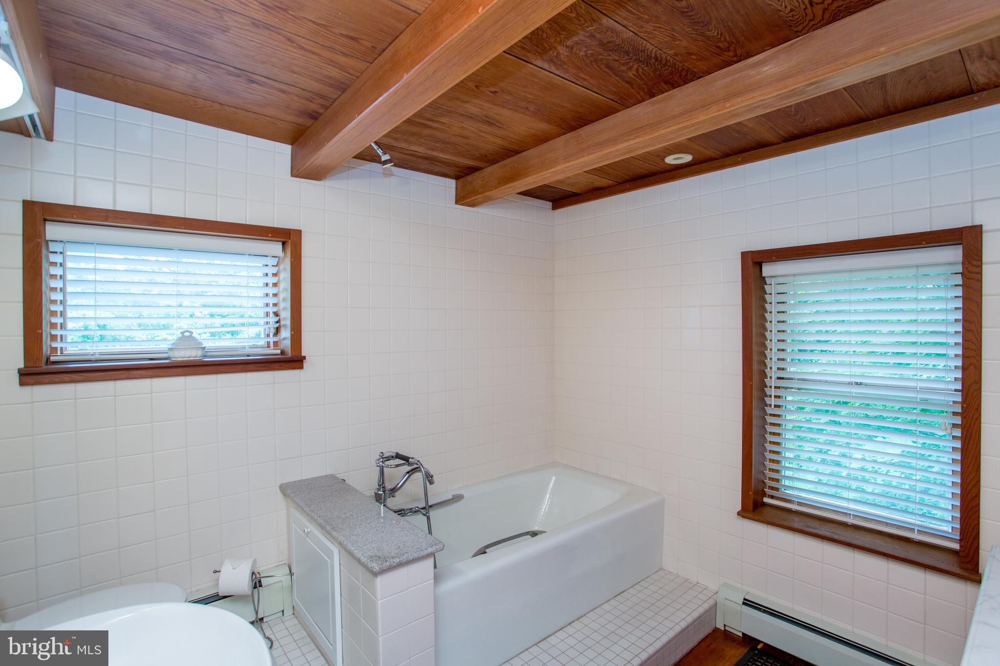 3416 Bursonville Road Riegelsville, PA 18077 - Photo 37 of 69 a bathroom with a toilet a sink and mirror