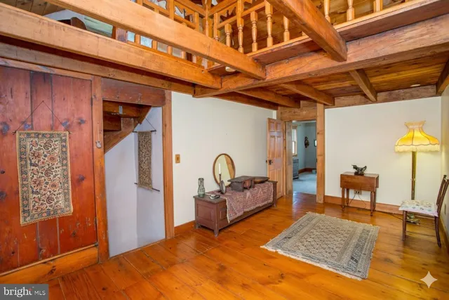 a view of a house with a yard and a wooden deck