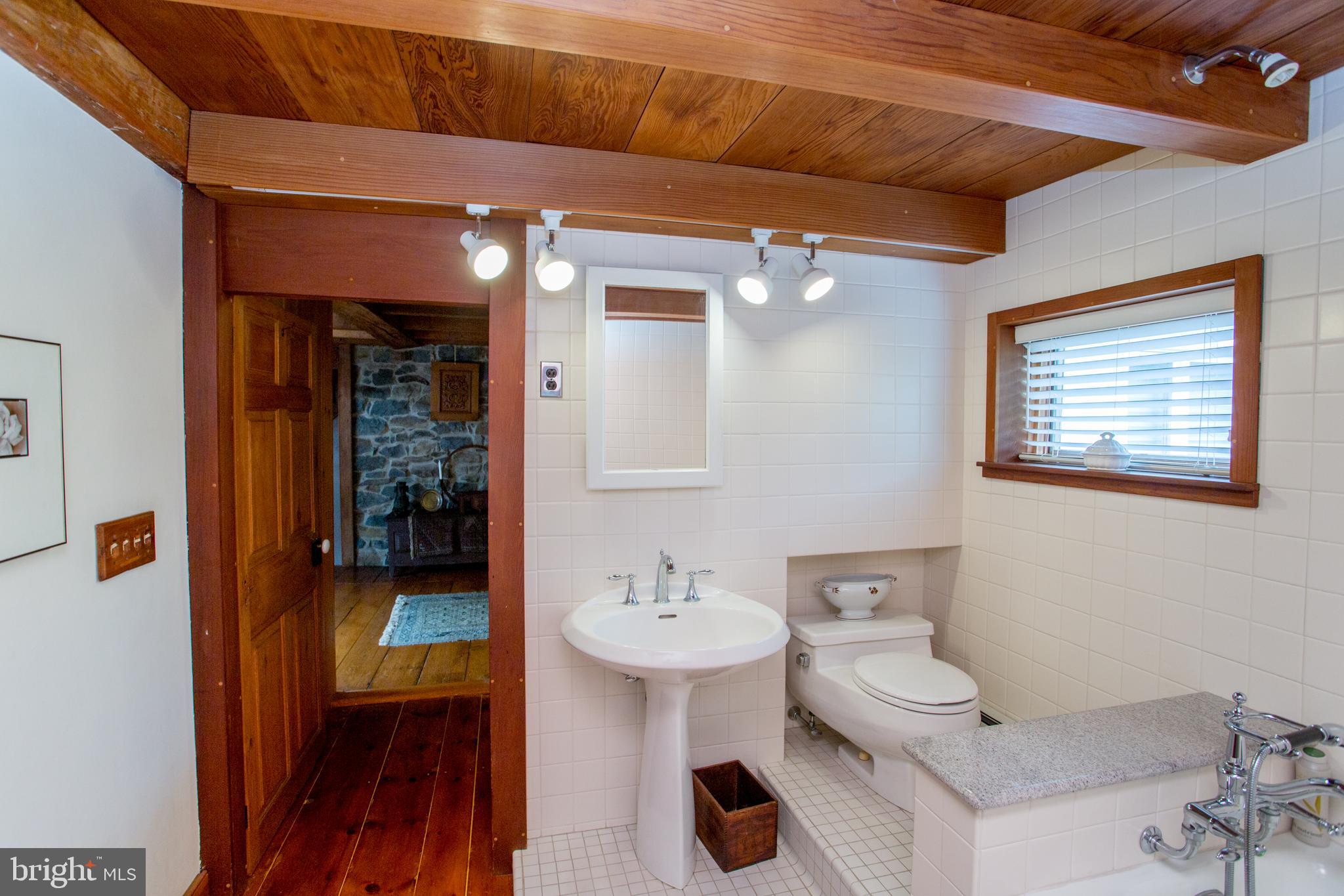 3416 Bursonville Road Riegelsville, PA 18077 - Photo 40 of 69 a bathroom with a sink and mirror