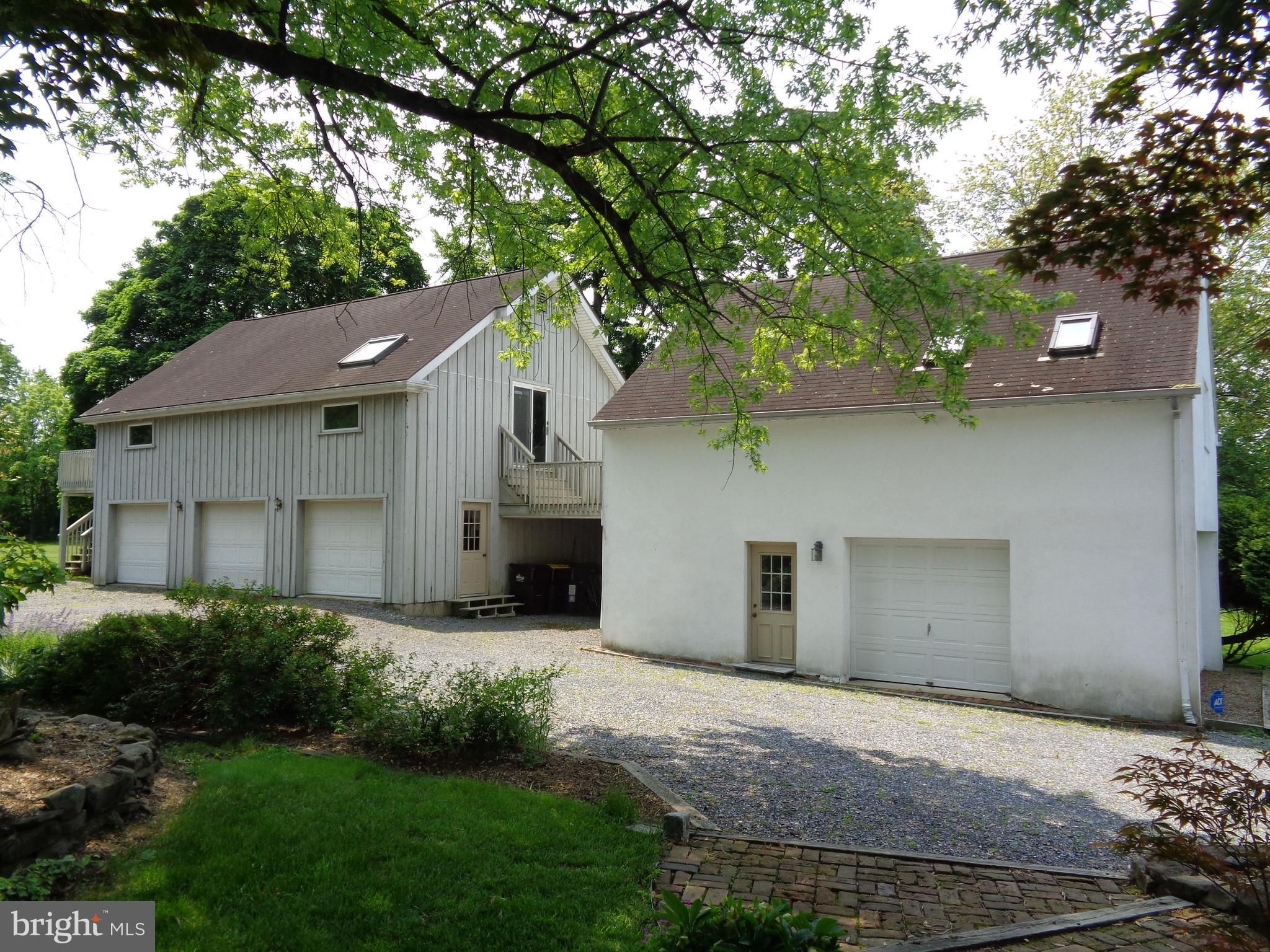 3416 Bursonville Road Riegelsville, PA 18077 - Photo 49 of 69 a front view of a house with a garden and yard