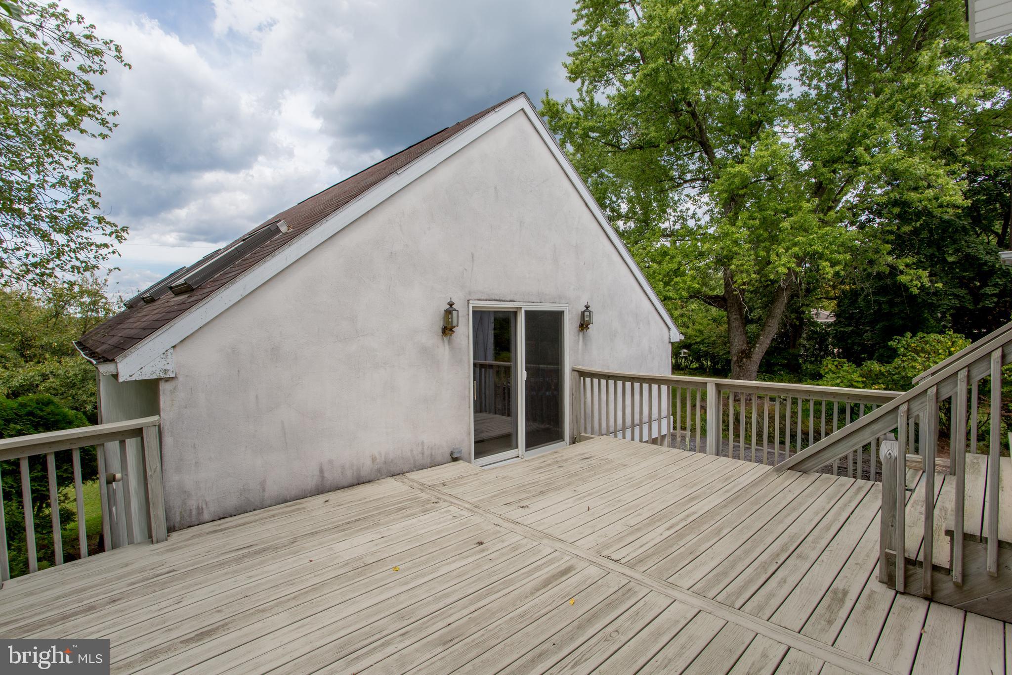 3416 Bursonville Road Riegelsville, PA 18077 - Photo 56 of 69 a view of backyard with a deck and wooden floor