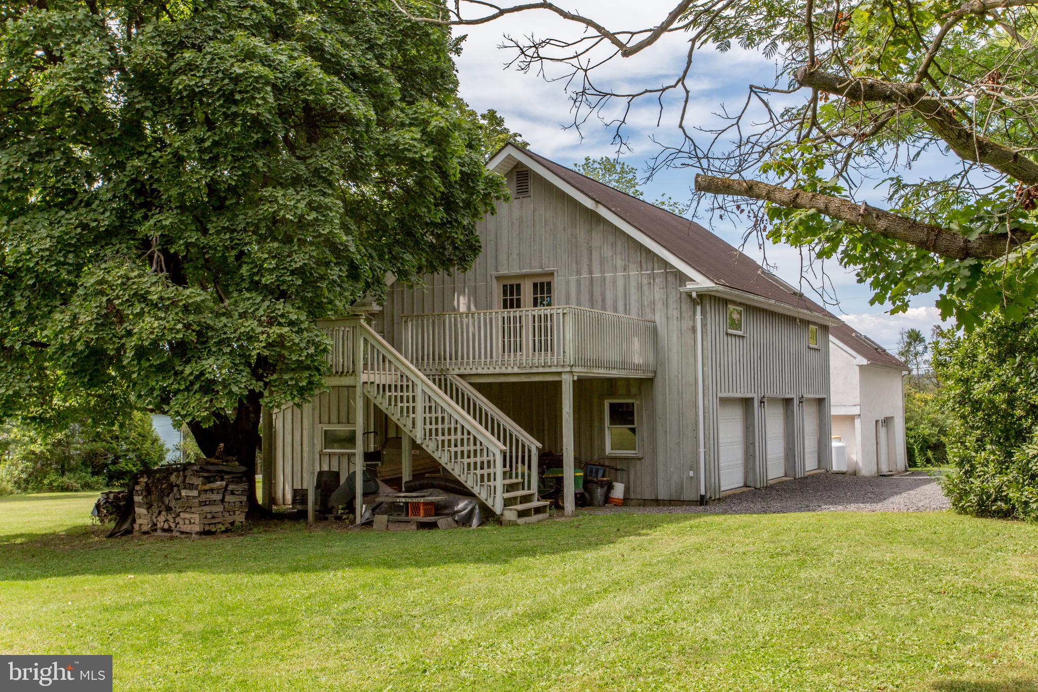 3416 Bursonville Road Riegelsville, PA 18077 - Photo 58 of 69 a view of a house with a yard and a wooden deck