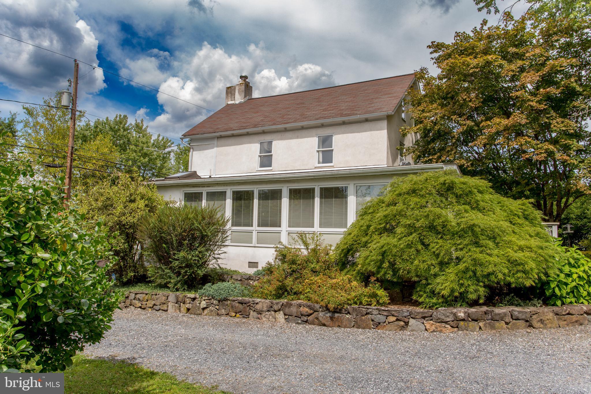 3416 Bursonville Road Riegelsville, PA 18077 - Photo 6 of 69 a front view of a house with garden