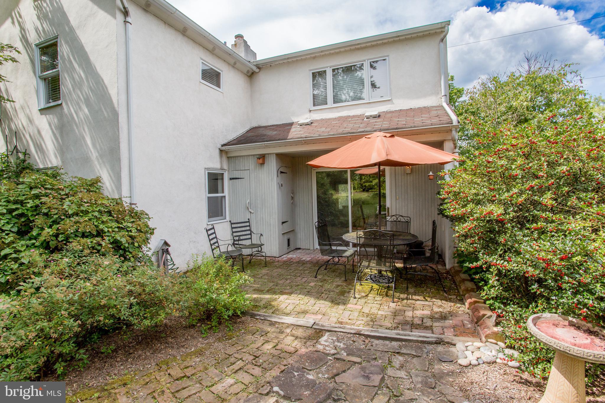 3416 Bursonville Road Riegelsville, PA 18077 - Photo 8 of 69 a view of a chair and table in backyard of the house